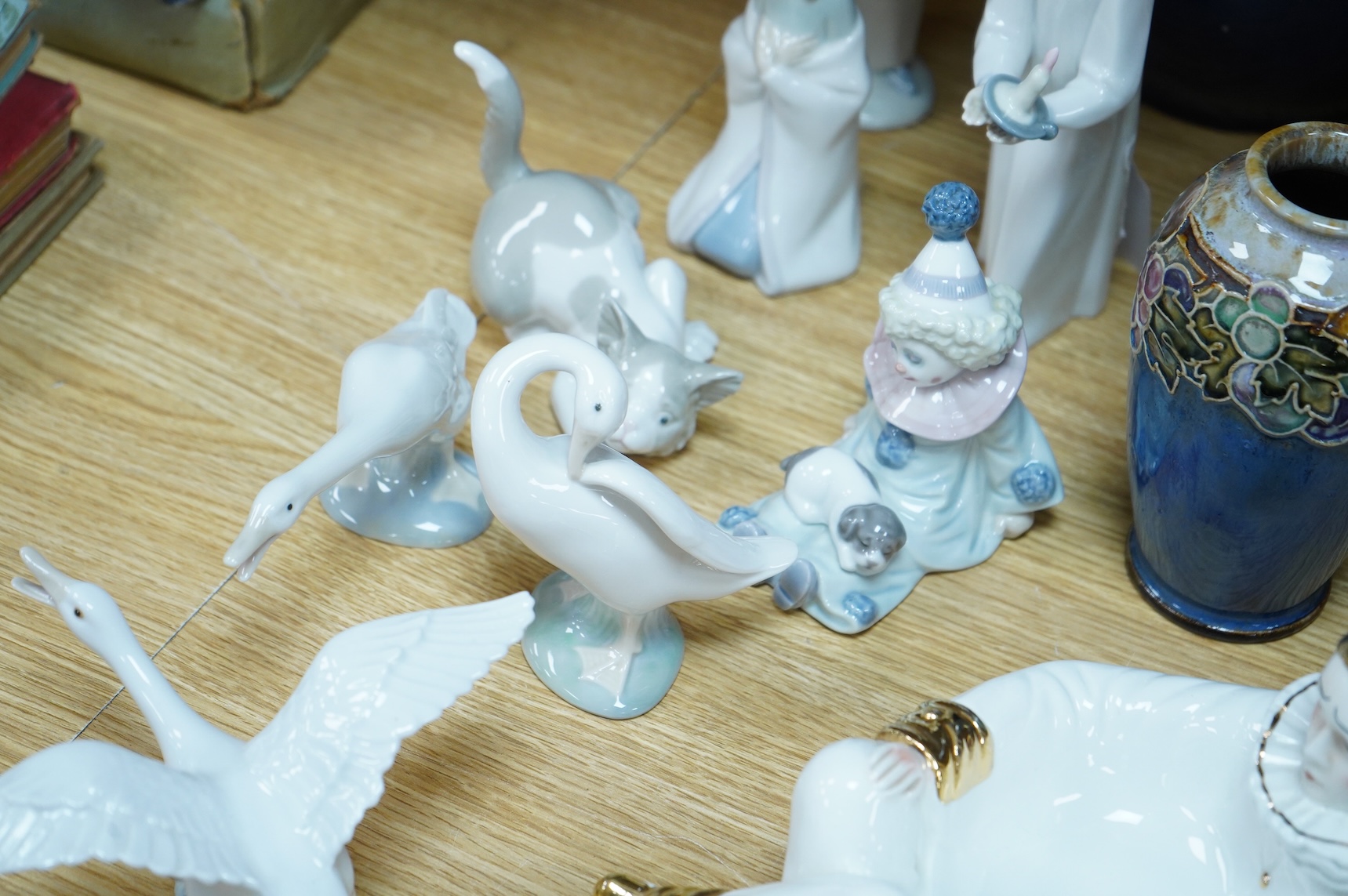 Two Doulton vases, a Casa Pupo pierrot dish and a collection of nine Lladro figures, largest 27cm high